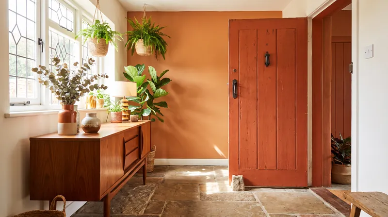Earthy oranges and terra-cottas are emerging as unexpected but highly livable neutrals that pair effortlessly with vintage decor.