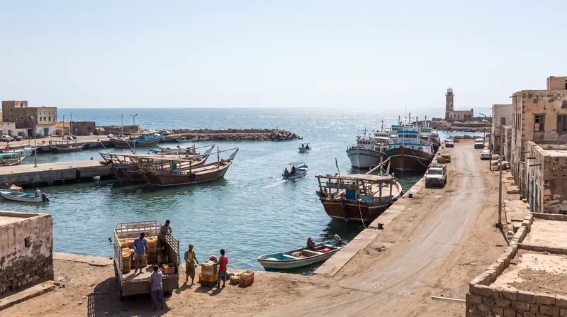A wide view of the coastal infrastructure and harbor facilities at the port of Mokha in Yemen.