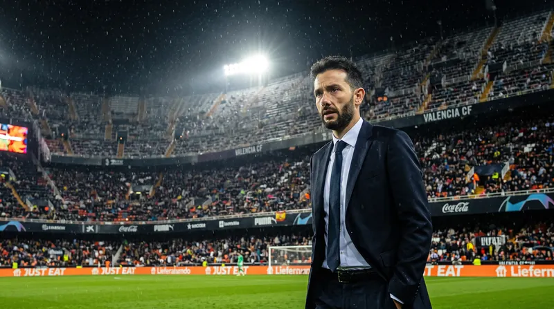 Valencia CF manager Carlos Corberán standing on the touchline looking concerned during a football match.