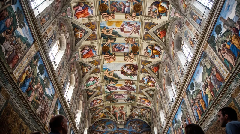 The brightly colored restored fresco of the Creation of Adam on the Sistine Chapel ceiling.