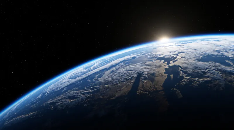 A view of Earth from high altitude showing the curvature of the planet and the thin atmosphere.