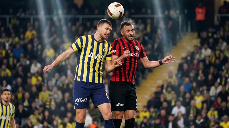 Fenerbahce and Gaziantep players competing for the ball during a high-stakes football match.