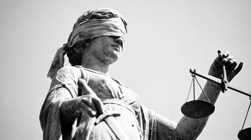 The concept of blind justice is foundational to the original position, ensuring rules are made without bias.