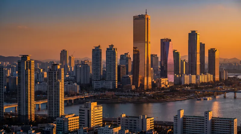 Aerial view of the Yeouido financial district skyline in Seoul, South Korea, showing dense corporate skyscrapers.