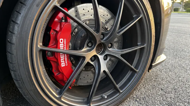 Performance vehicles use expensive materials like carbon-ceramic to reduce unsprung mass and maximize tire contact.