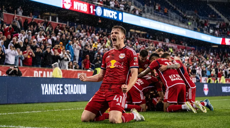 Julian Hall of the New York Red Bulls celebrates scoring a goal on the soccer pitch.
