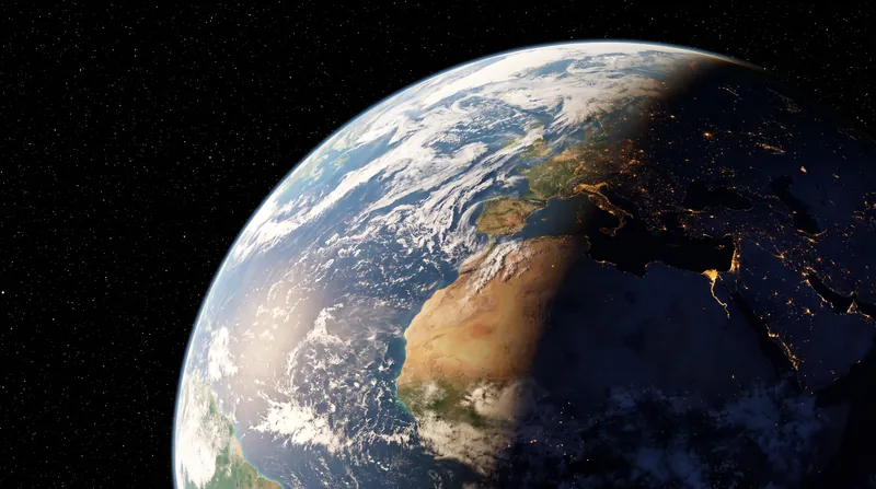 The Earth viewed from space, showing the terminator line between day and night.