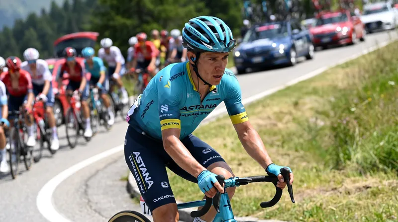 Professional cyclist Miguel Ángel López riding in his Astana Qazaqstan team kit during a race.
