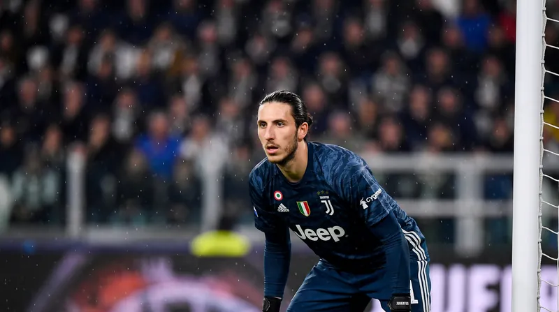 Juventus goalkeeper Kamil Grabara wearing his official kit and looking focused during a stadium match.