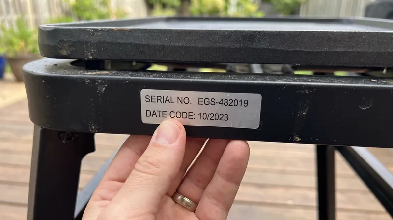 The recall is limited to grills with date codes 2510, 2511, and 2512, located on the bottom shelf or side bar.