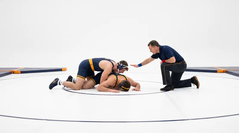 A legal pinfall requires both of the defending wrestler's shoulders to be held flat against the mat simultaneously.