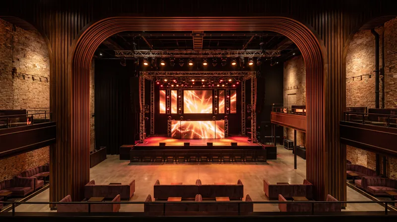 The 600-capacity room features heritage brickwork and bronze balconies that pay homage to the building's 1930s industrial design.