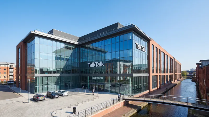 Exterior view of a modern glass office building representing TalkTalk headquarters in the United Kingdom.