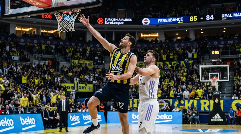 A Dubai Basketball player drives past a Real Madrid defender during their EuroLeague opening game.
