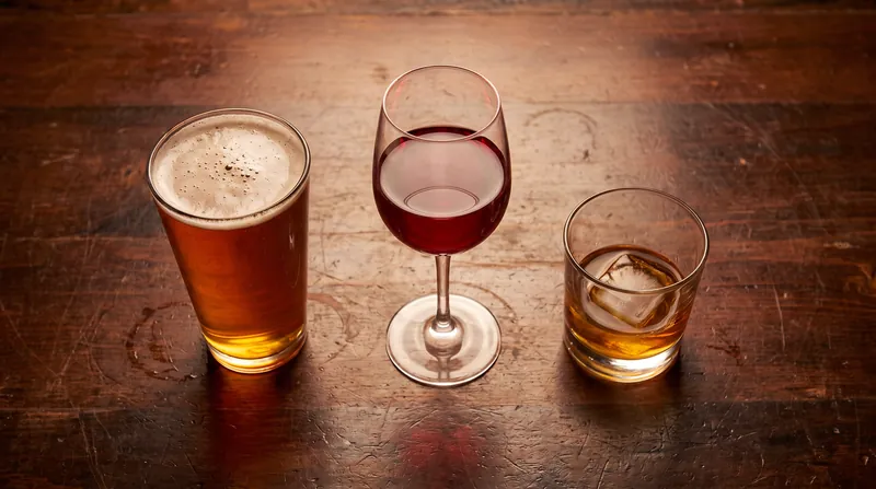 Despite vastly different liquid volumes, a 12-ounce beer, a 5-ounce glass of wine, and a 1.5-ounce shot of spirits all contain 14 grams of pure ethanol.