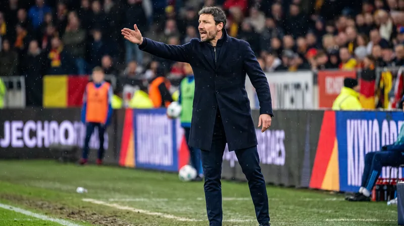 Mark van Bommel secured a 2-0 victory over Italy in his debut as Belgium's manager.
