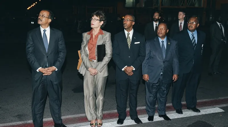 Exterior view of the Ethiopian Ministry of Foreign Affairs building in Addis Ababa with security personnel.