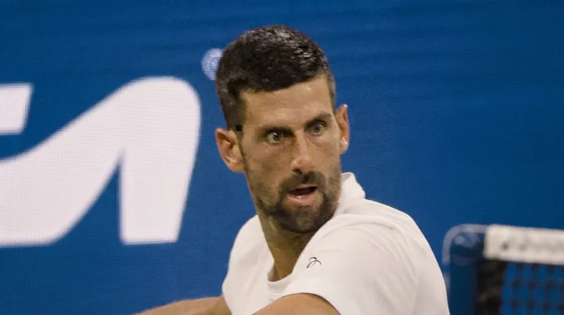 Novak Djokovic survived a grueling three-hour match to keep his 31-0 Beijing record alive.