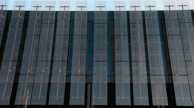 The modern glass and steel exterior of the Court of Justice of the European Union in Luxembourg.