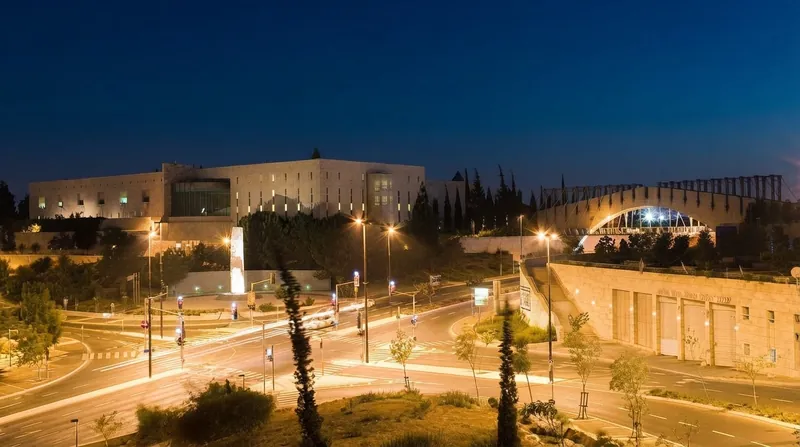 The modern stone architecture and geometric lines of the Israeli Supreme Court building in Jerusalem.