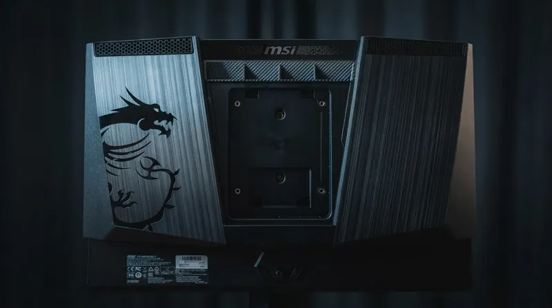 A close-up of a modern OLED television displaying a high-contrast video game scene in a dark room.