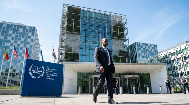 The exterior of the International Criminal Court building in The Hague against a clear sky.