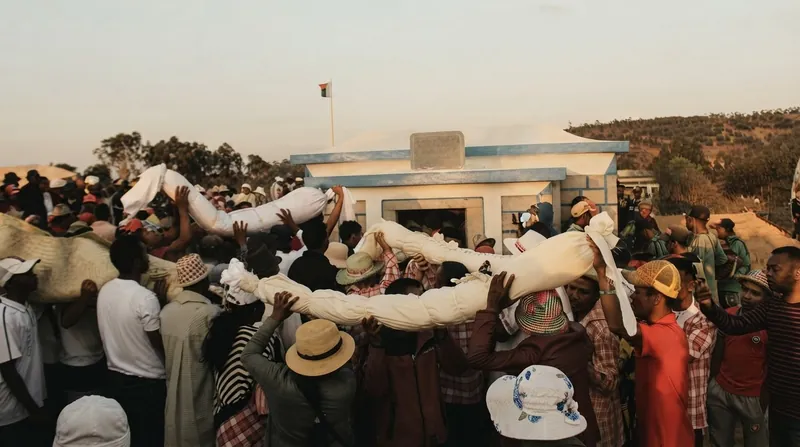 During Famadihana, Malagasy families wrap the remains of their ancestors in fresh silk and dance with them to live music.