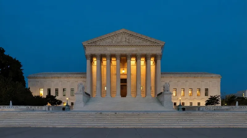 A softly lit law library showing rows of antique leather-bound Supreme Court reporters and an open textbook.