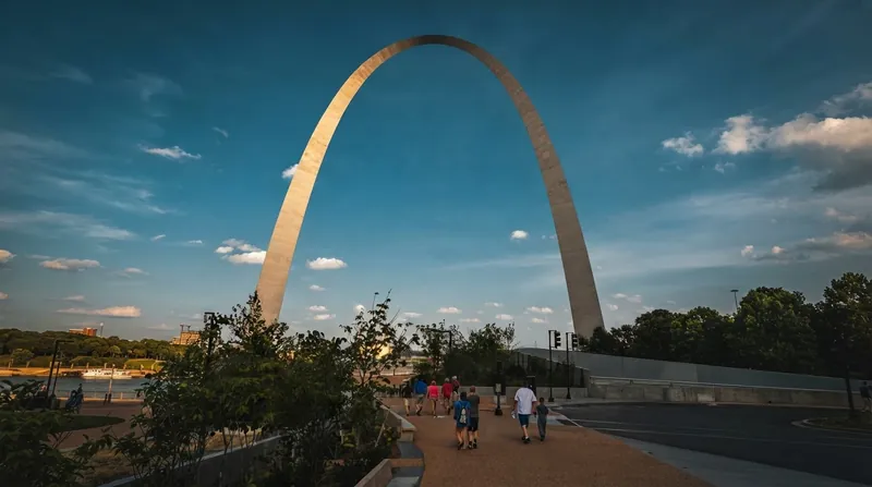 The Gateway Arch utilizes a weighted catenary equation to account for its thicker bases, keeping the structure in compression.