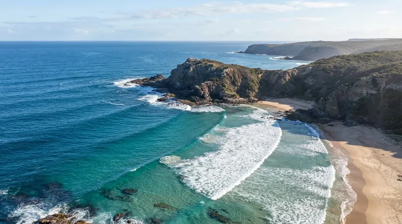 Illustration: Shallow water around rocky points causes waves to refract and wrap around the headland, concentrating their erosive energy.