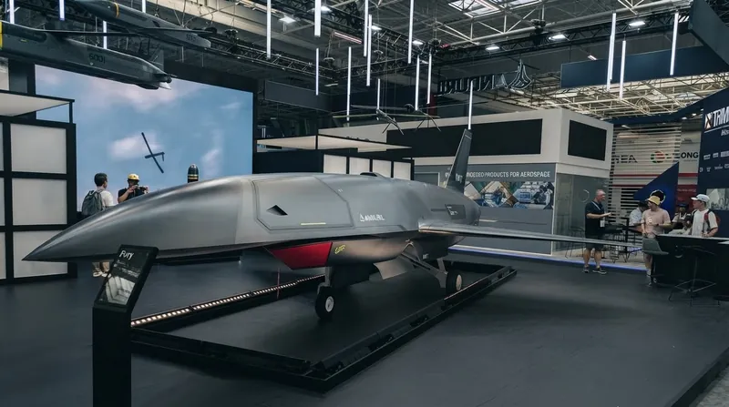 An Anduril Fury autonomous wingman drone taxiing on a military runway.