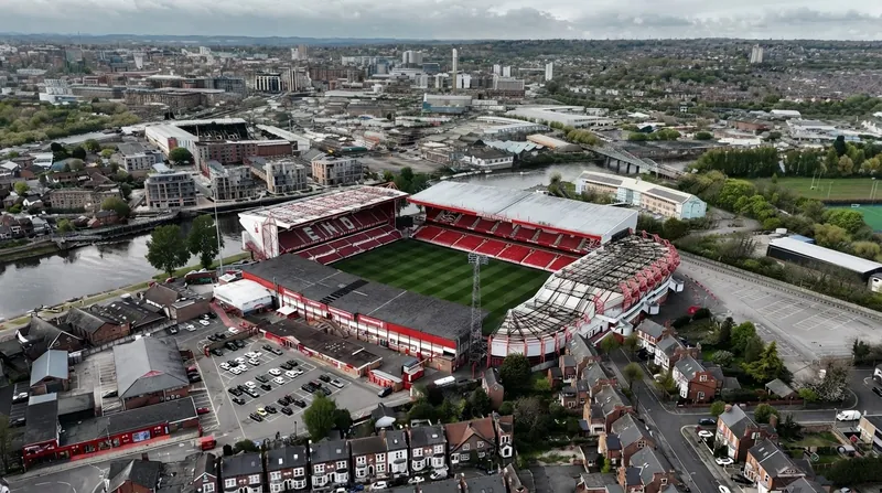 A wide view of the City Ground stadium pitch prepared for a Premier League match.