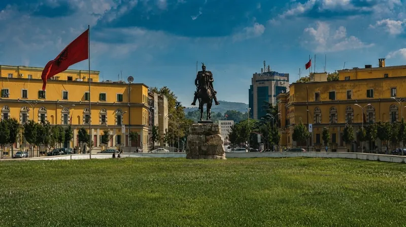 Thick smoke billows from the ground floor of the Supreme Court building in Tirana behind police barricades.