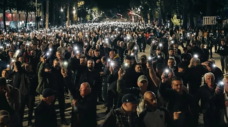 Riot police deploy tear gas and rubber bullets to hold back crowds in central Tirana.