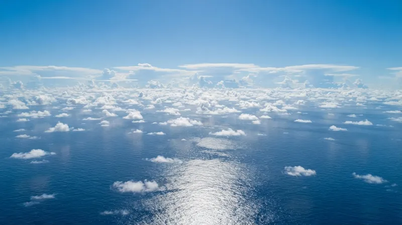 Illustration: Shallow cumulus clouds lose their buoyancy when they hit the warm inversion layer, forcing them to spread horizontally instead of growing vertically.
