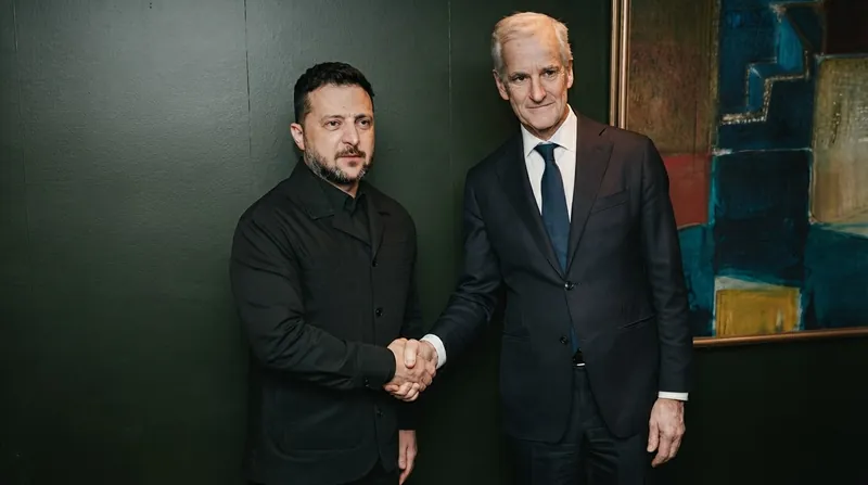 Ukrainian President Volodymyr Zelenskyy and Norwegian Prime Minister Jonas Gahr Store walking together outdoors in Oslo.