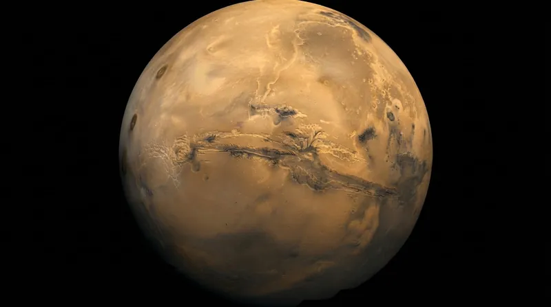 An orbital view of the massive Valles Marineris canyon system cutting across the rust-colored Martian surface.