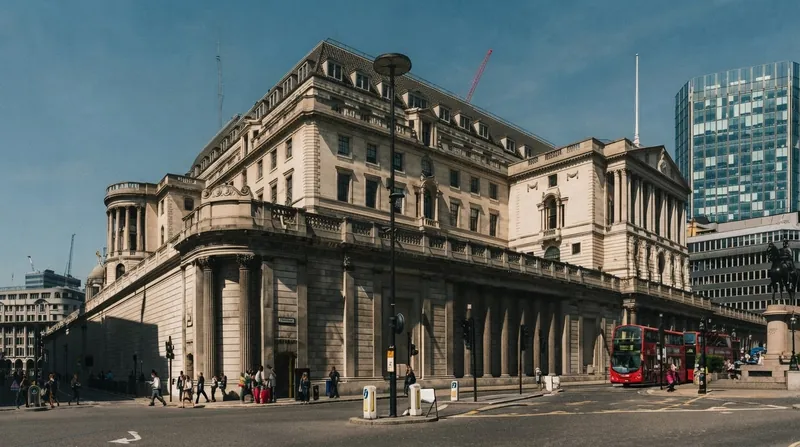 Exterior view of the Bank of England headquarters building in London under an overcast sky.
