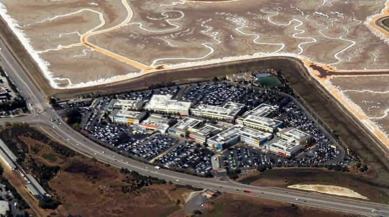 The exterior of a Meta Platforms corporate office building featuring the company's infinity logo.