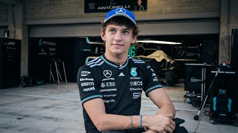 A Mercedes Formula 1 car navigating a high-speed corner at the Circuit of the Americas track in Austin, Texas.