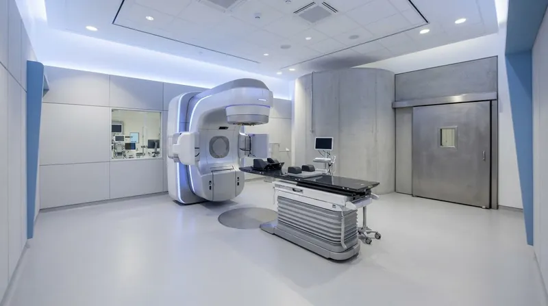Illustration: Advanced imaging maps the brain so the linear accelerator can deliver micro-doses strictly to affected neural circuits.