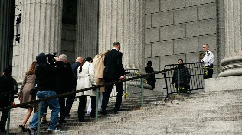 The settlement preserves the survivors' right to pursue additional damages from the archdiocese's commercial insurance carriers in state court.
