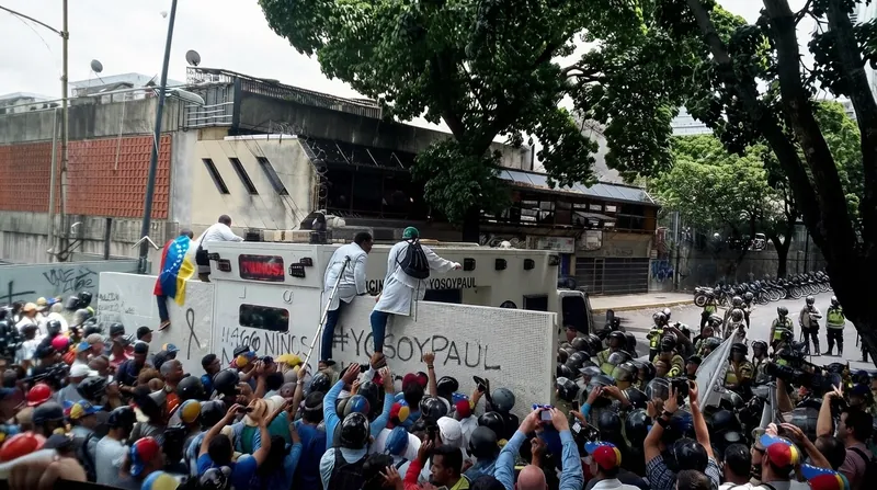 Security forces maintained a heavy presence on highways leading toward Caracas following news of Machado's return.