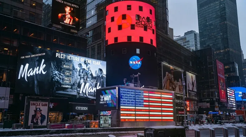 The Nasdaq MarketSite display in Times Square showing the Anthropic logo and ticker symbol ANT.