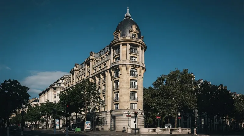 The exterior facade of the BNP Paribas headquarters building in Paris, featuring the corporate logo.