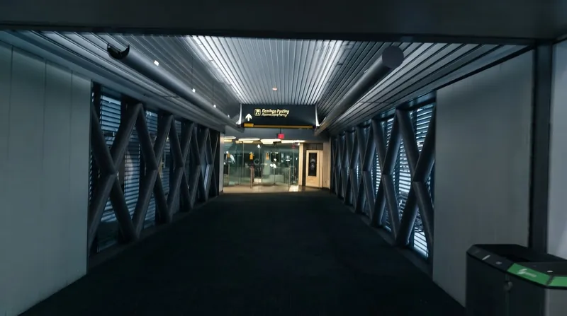 Exterior view of the international arrivals terminal at Miami International Airport during the daytime.